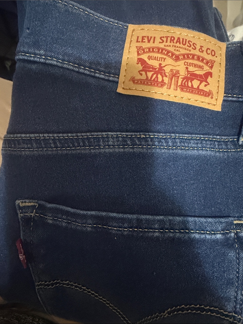 Levi's Women's High Rise Dark Blue Jeans with Tan Patch